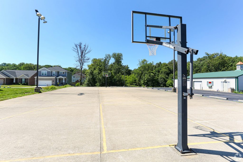 a basketball hoop in a parking lot