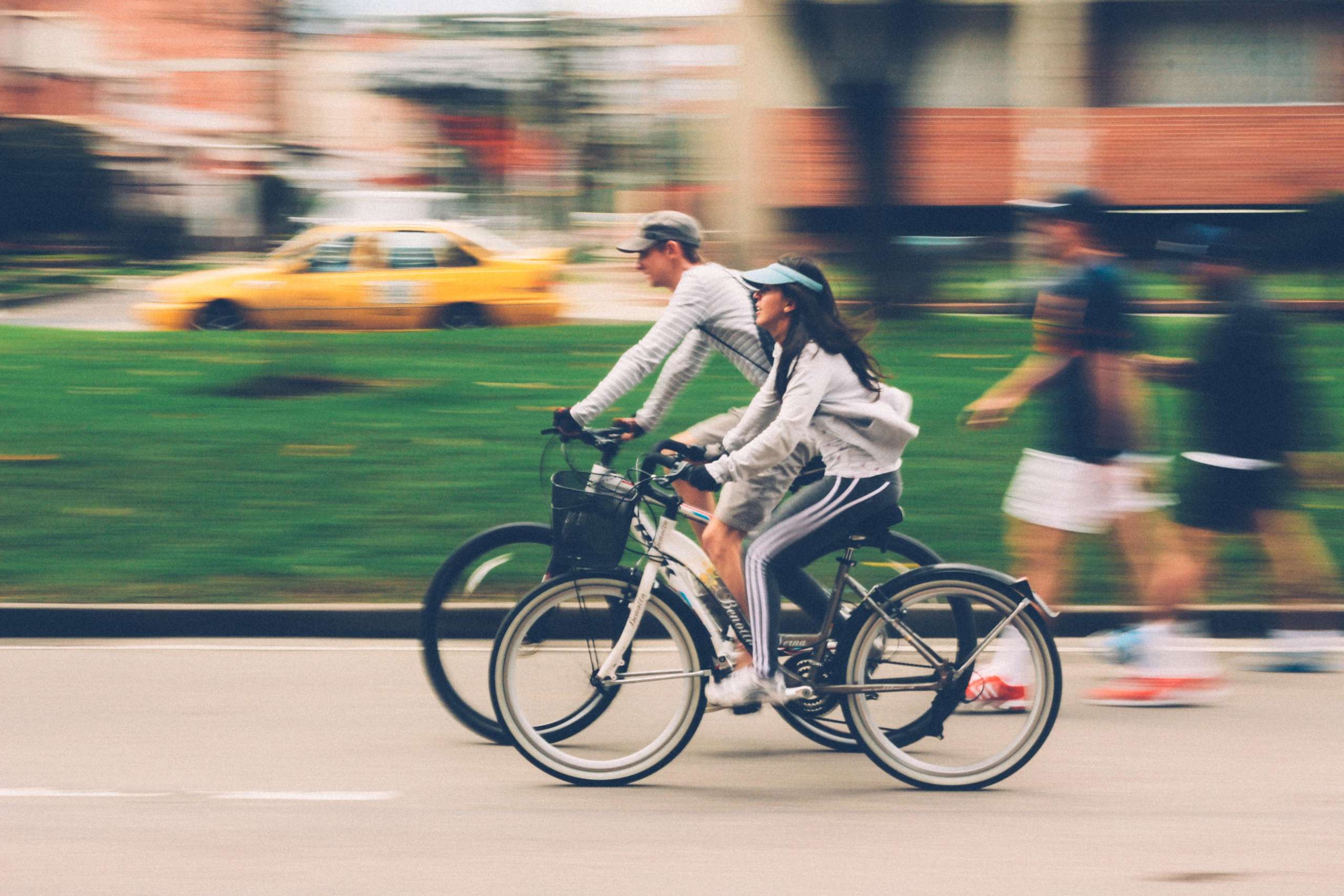 a man and woman riding bicycles